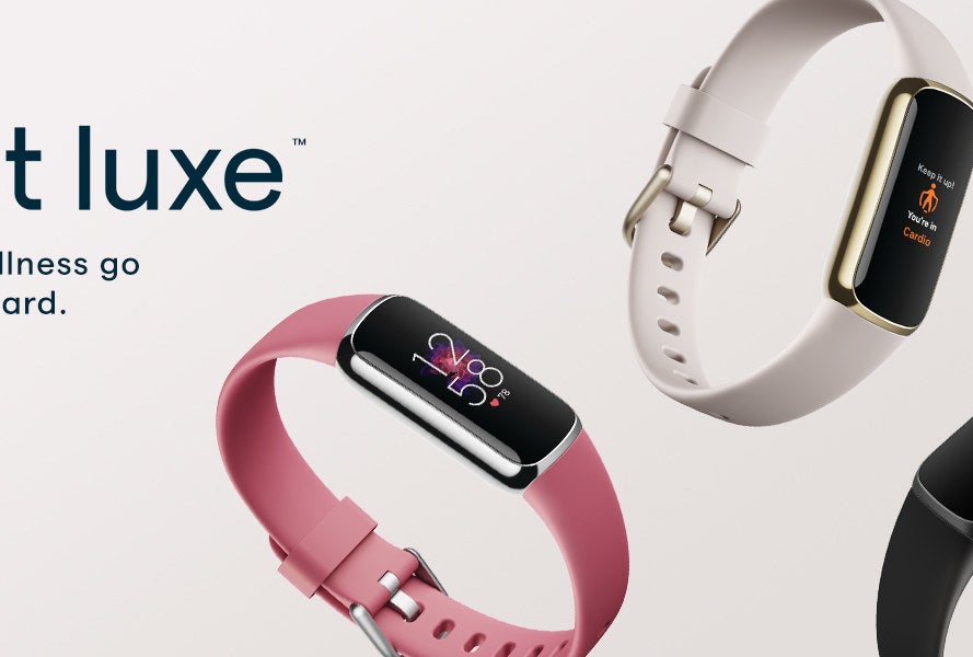 the Fitbit Luxe fitness trackers in pink, white, and black