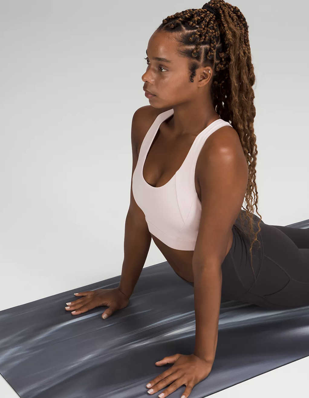 A person doing a yoga pose on the yoga mat