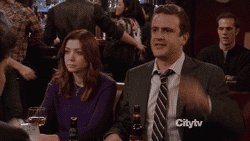GIF of man and woman high-fiving