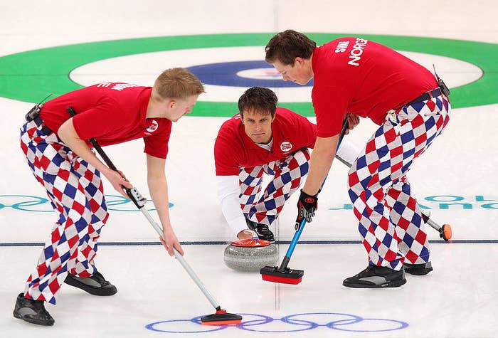 A men&#x27;s curling team competes at the Olympics