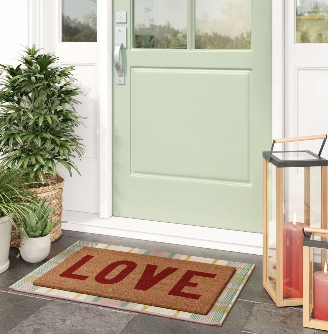 The brown doormat says &quot;LOVE&quot; in large red block letters