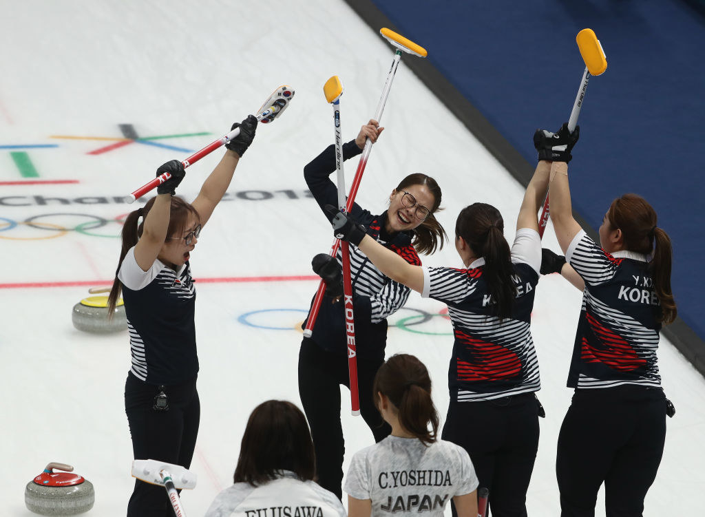 South Korea celebrates after winning a curling match