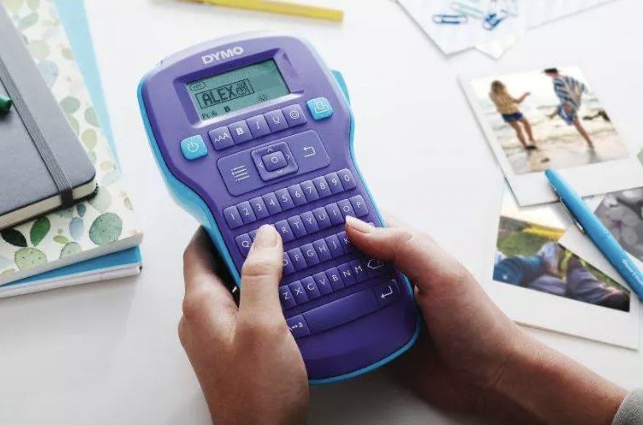 Hand holding purple label maker