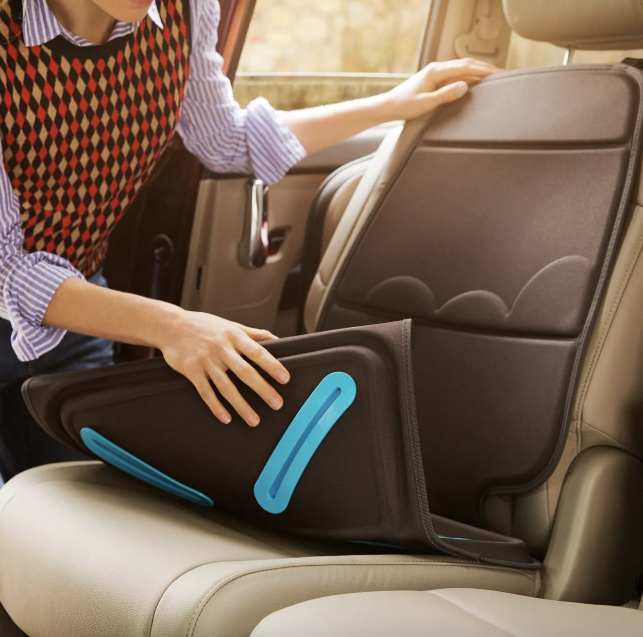 Person putting cover down in car