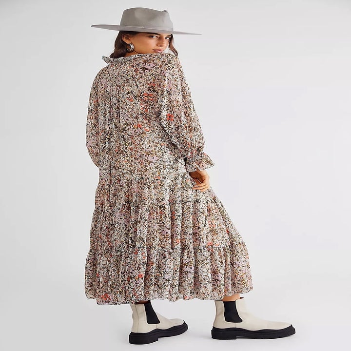 back of model wearing the dress with white and black combat boots