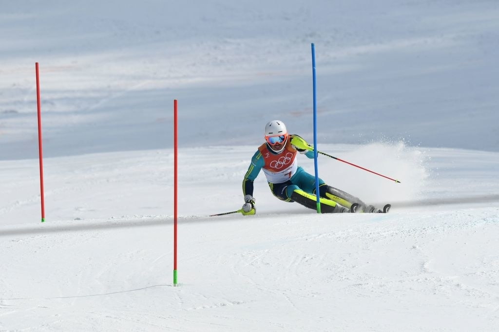 A skier competes in the slalom