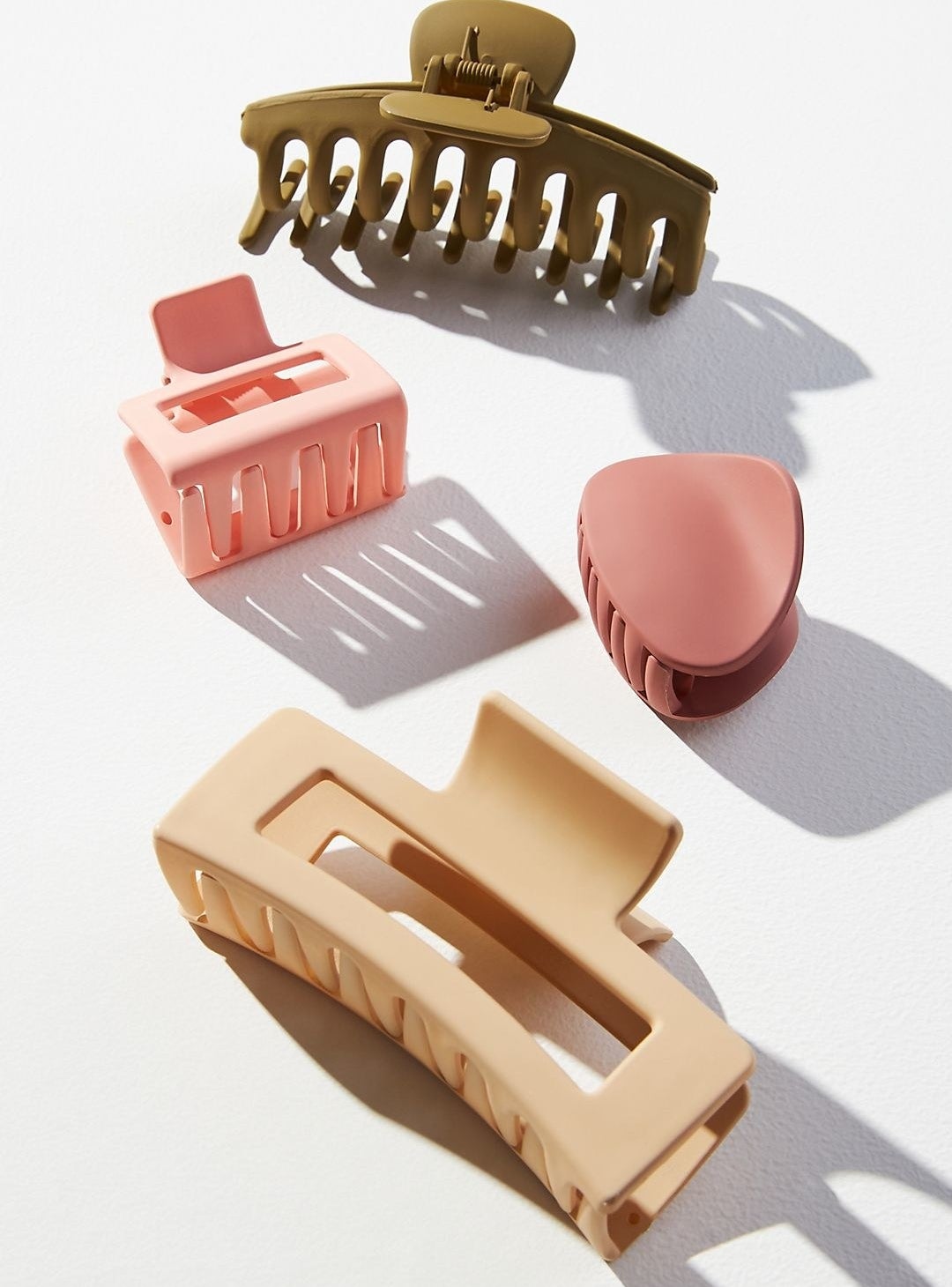 the set of four clips in khaki, pinks, and beige