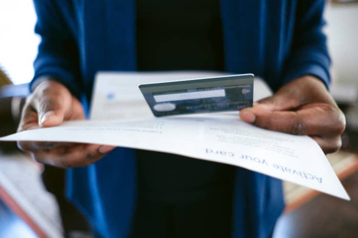 Person holding a new credit card