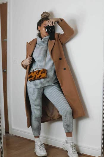 a different model wearing the gray set with a trench coat