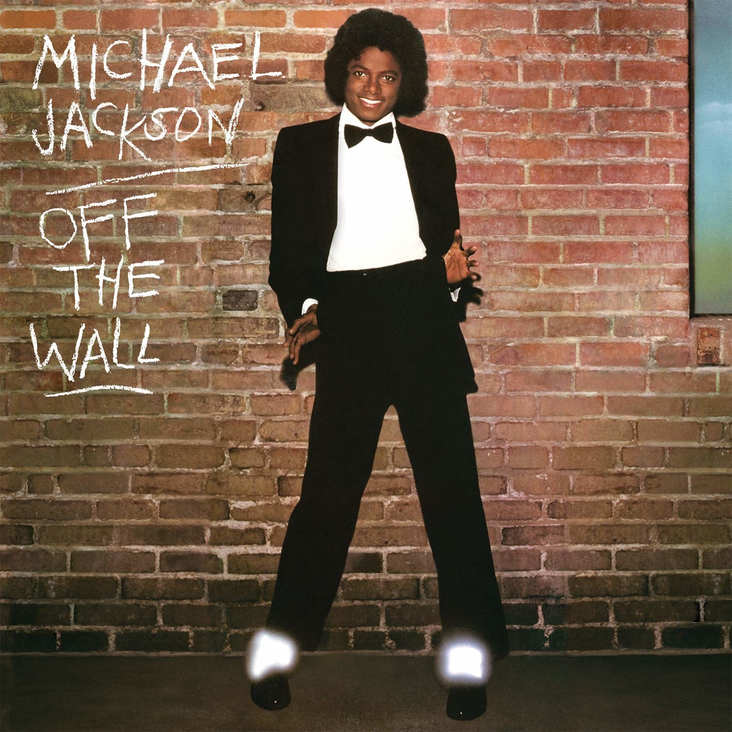 Michael Jackson in a tux against a brick wall cover of Off The Wall