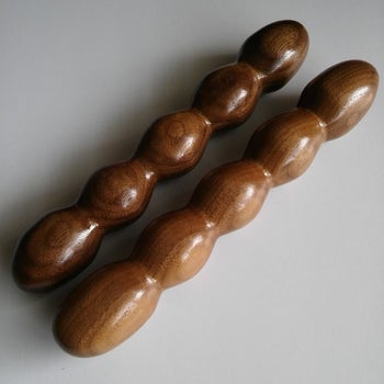 Two wooden dildos