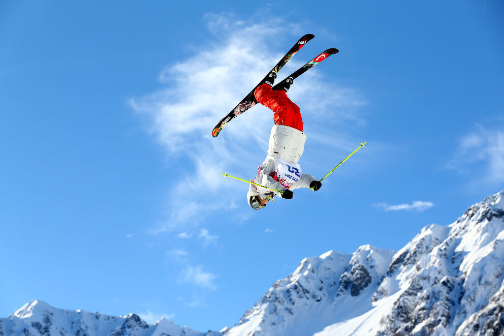 A skier flips upside down during an event