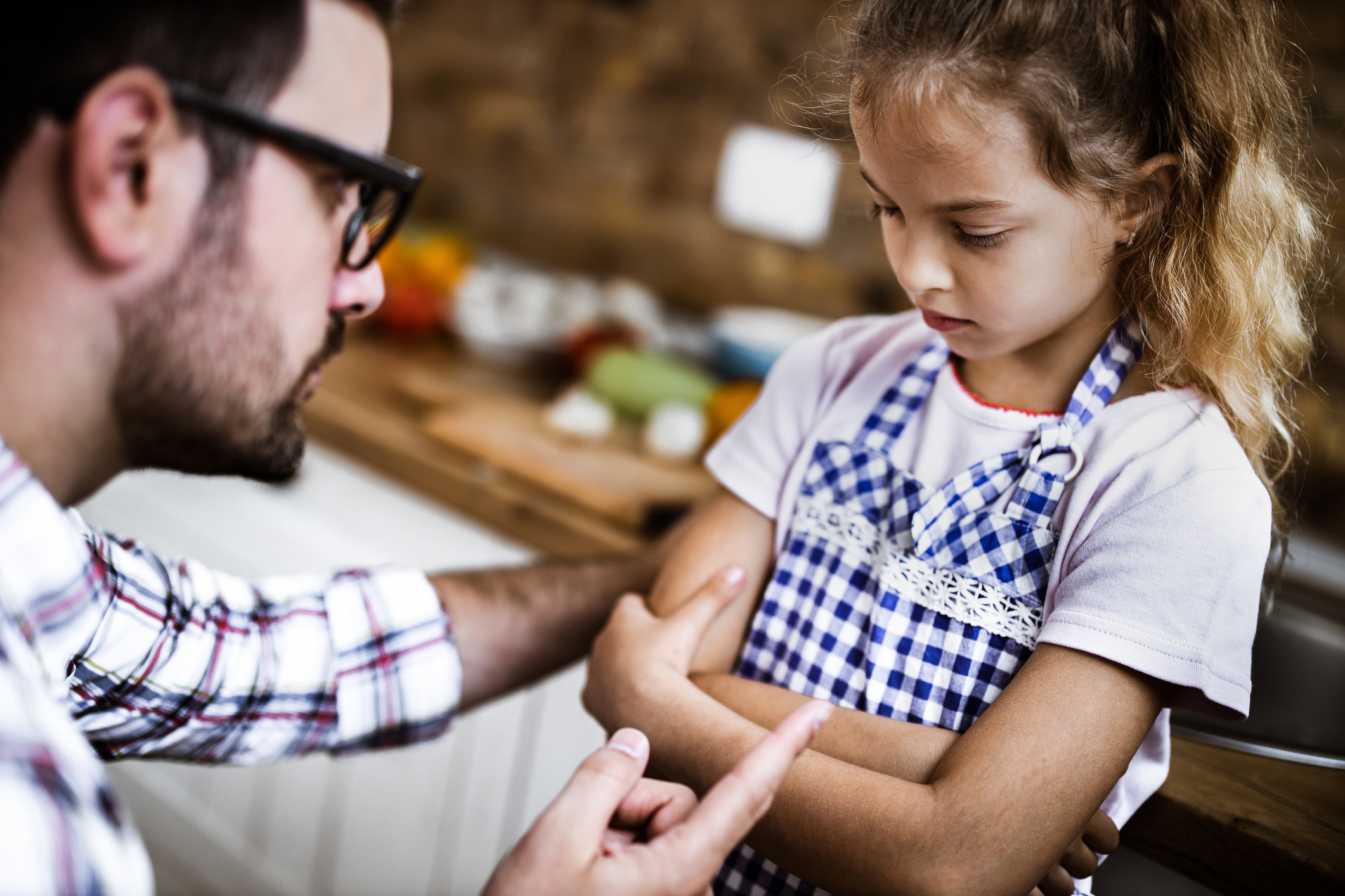 A stock image of a man scolding a child