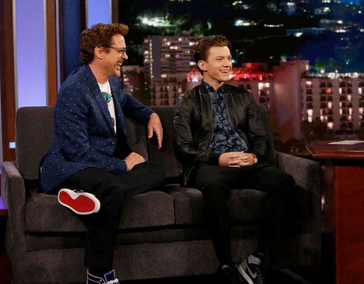 RDJ and tom holland laughing during a talk show interview