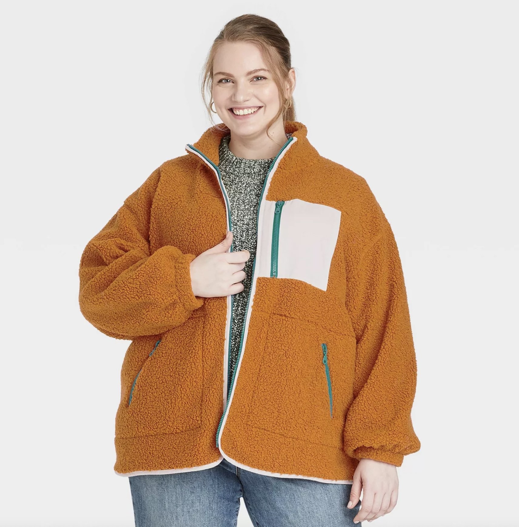 model wearing the sherpa in orange
