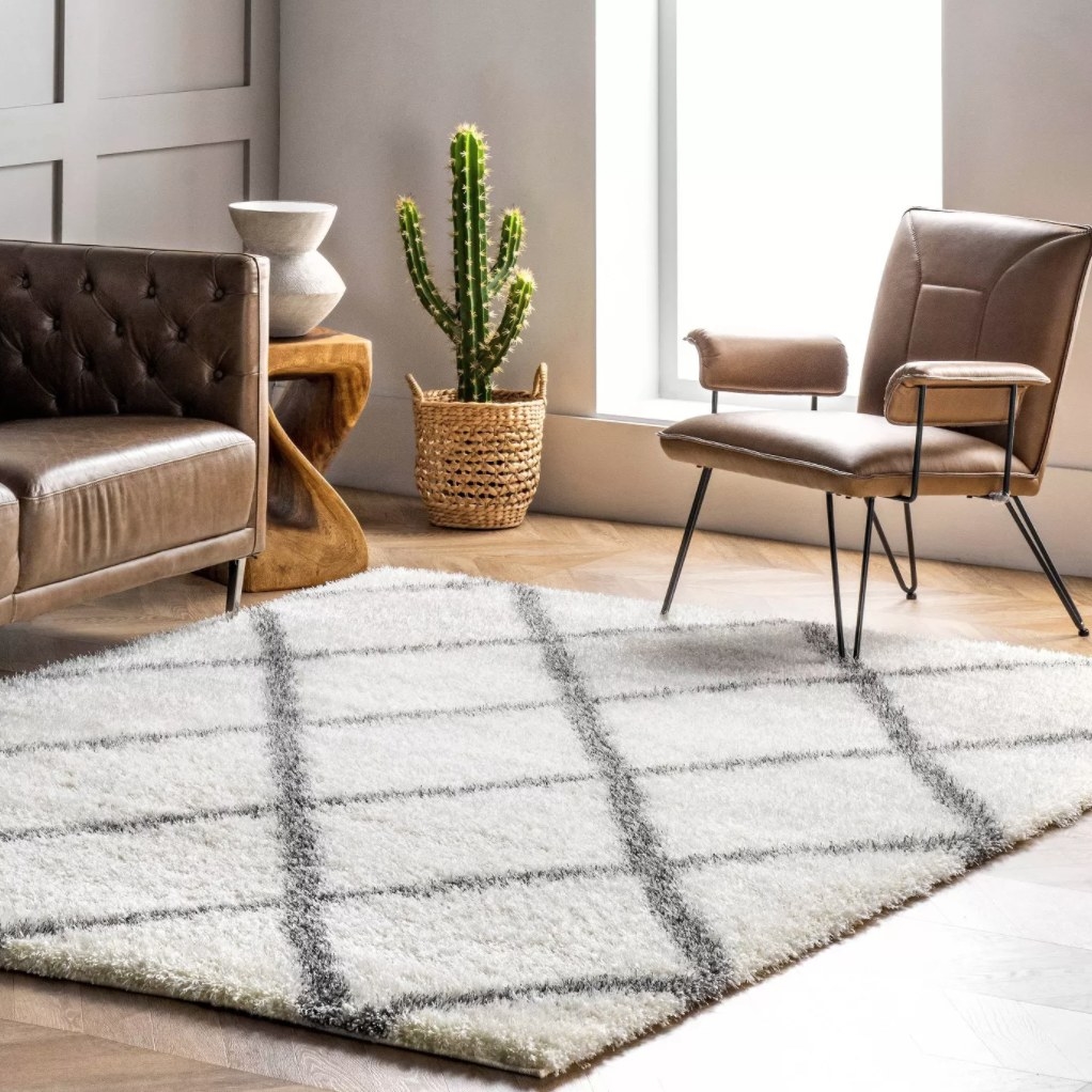 the area rug in white and grey diamond shapes