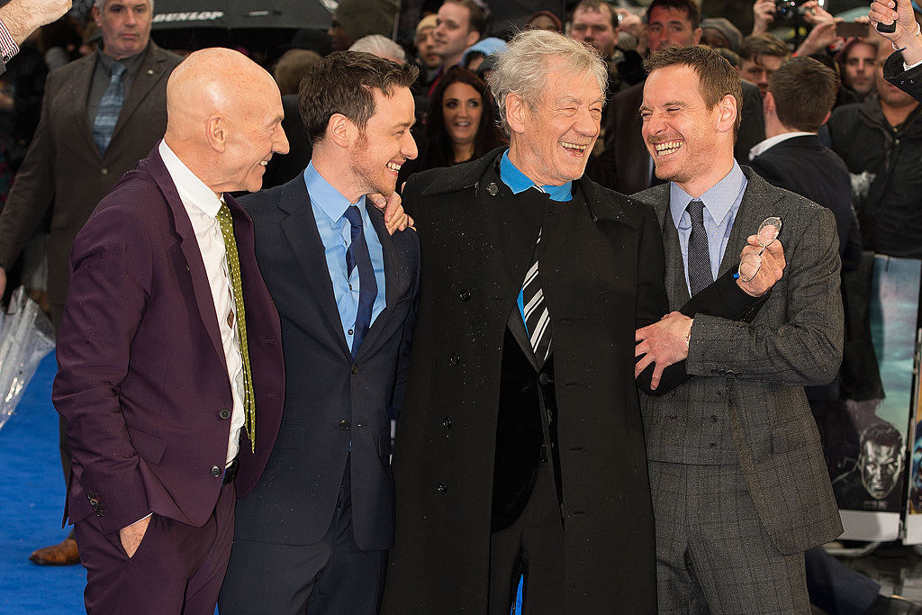 James mcavoy and michael fassbender posing with patrick stewart and ian mckellen