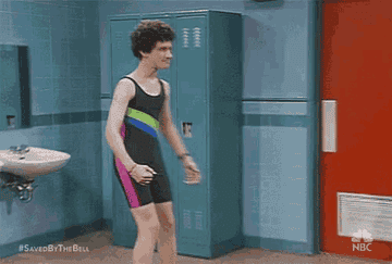 Screech flexing his muscles in a wrestling unitard on &quot;Saved By The Bell&quot;