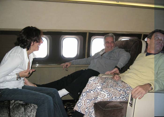 Three people sitting on a plane