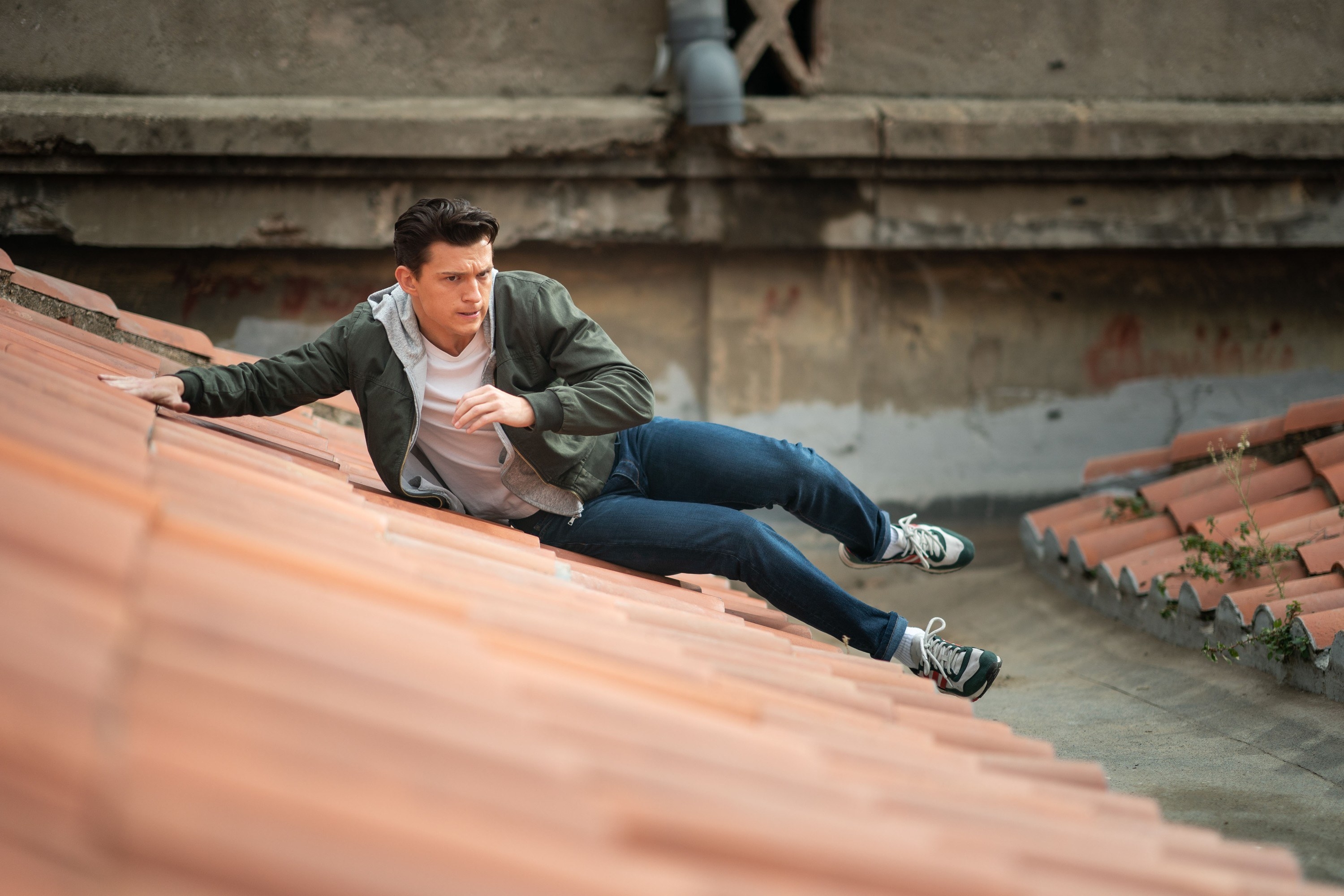 Tom slides down a roof