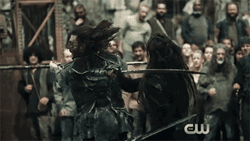 The fight scene between Alycia Debnam-Carey as Lexa and Zach McGowan as Roan in &quot;The 100&quot;