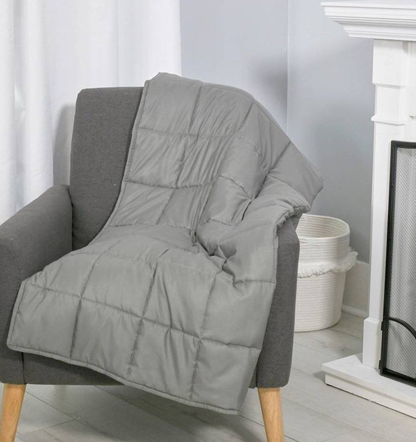 grey weighted blanket on a chair