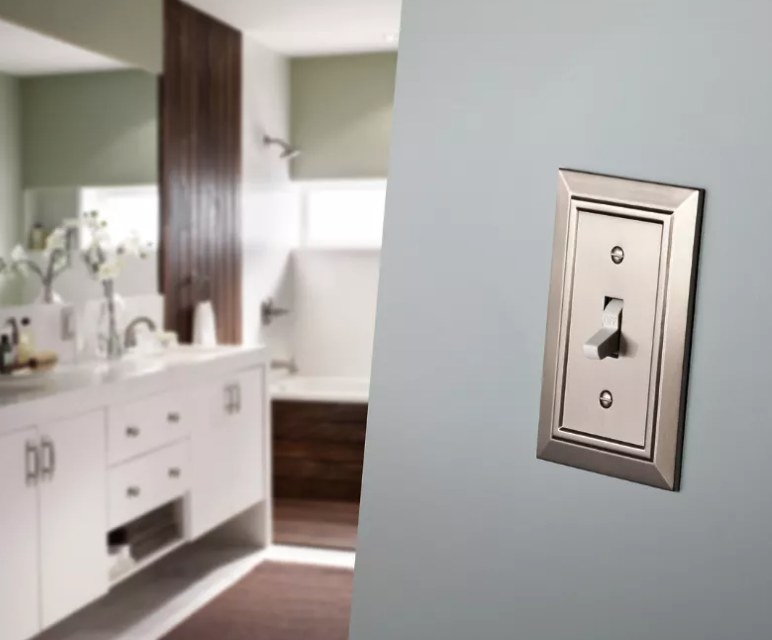 A nickel decorative switch plate