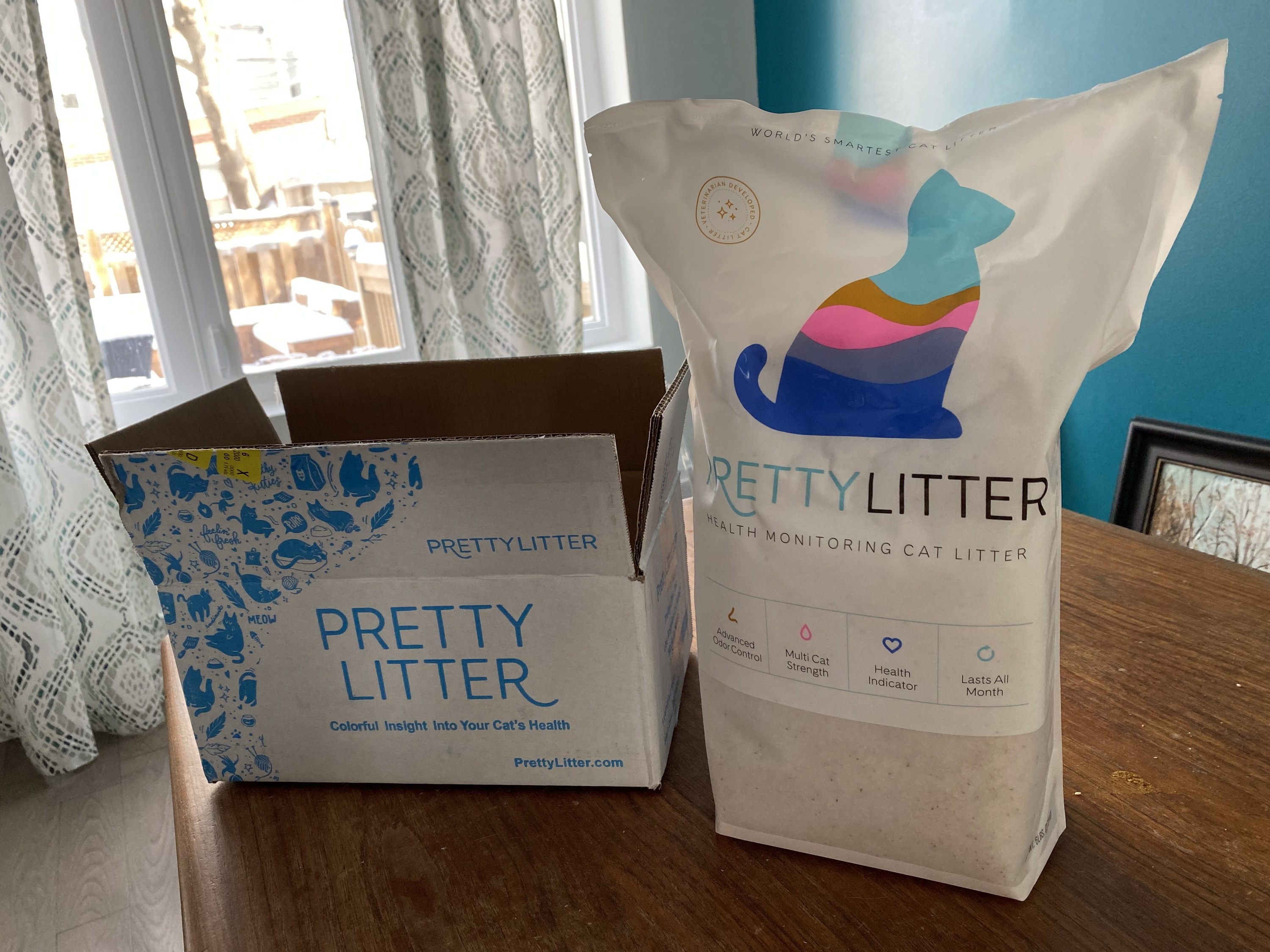 The bag of Pretty Litter and the small box it ships in