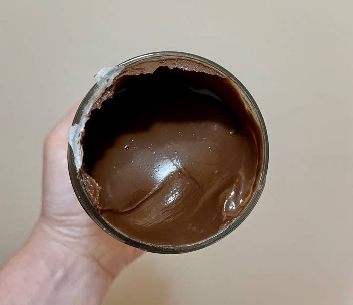 opened jar to reveal thick, hazelnut cocoa spread