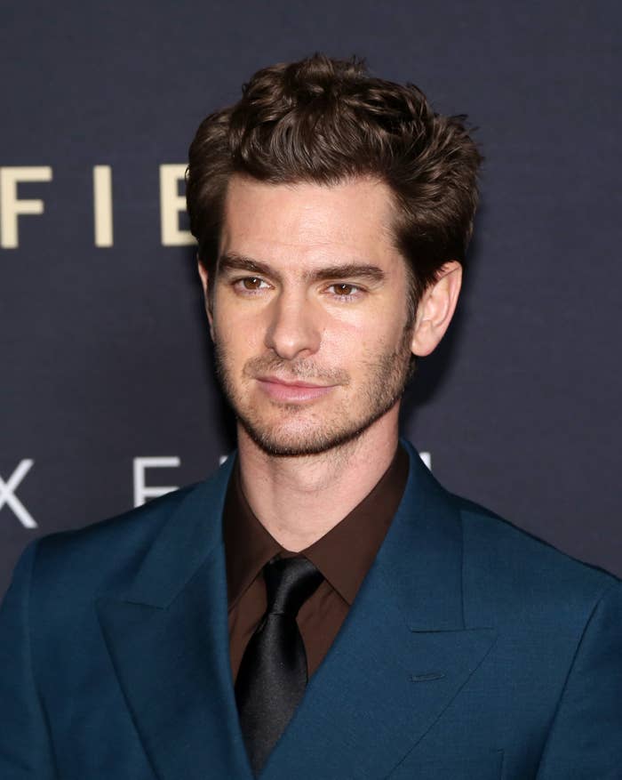 A closeup of Andrew wearing a suit