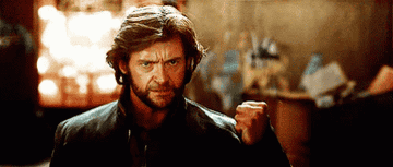 Hugh Jackman as Wolverine in X-Men produces knives out of his hands