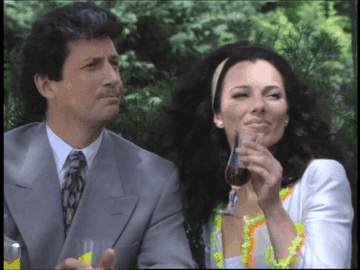 Charles Shaughnessy and Fran Drescher with wine pointing in The Nanny