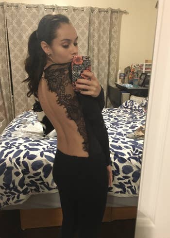 reviewer showcasing back of bodysuit