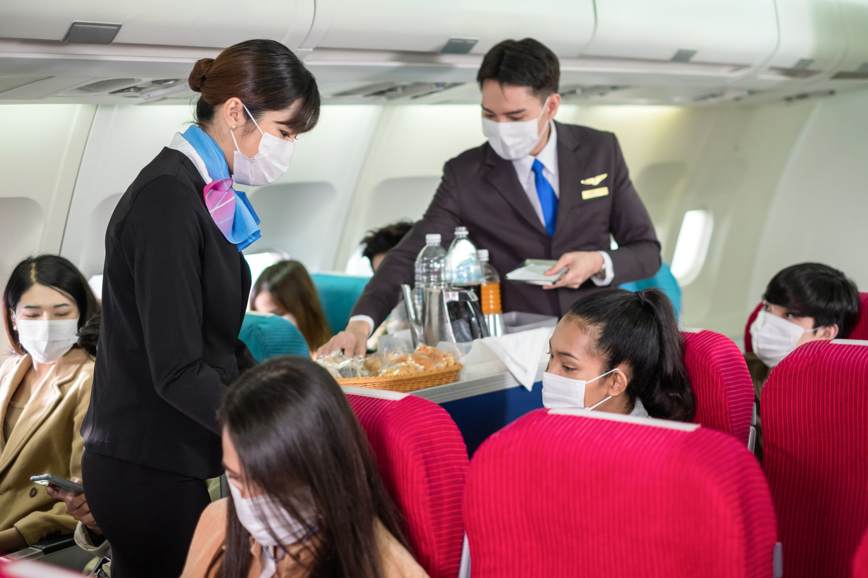 flight attendants serving drinks