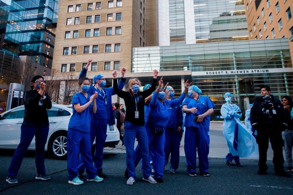 healthcare workers cheer