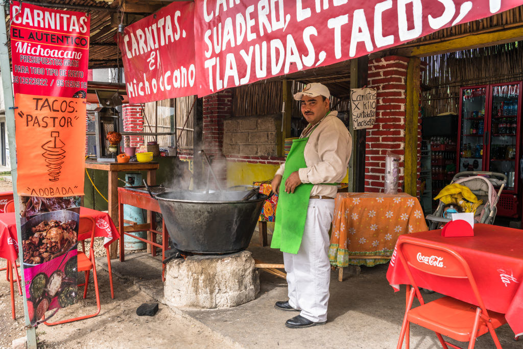 A man cooking at this food stand in Mexico