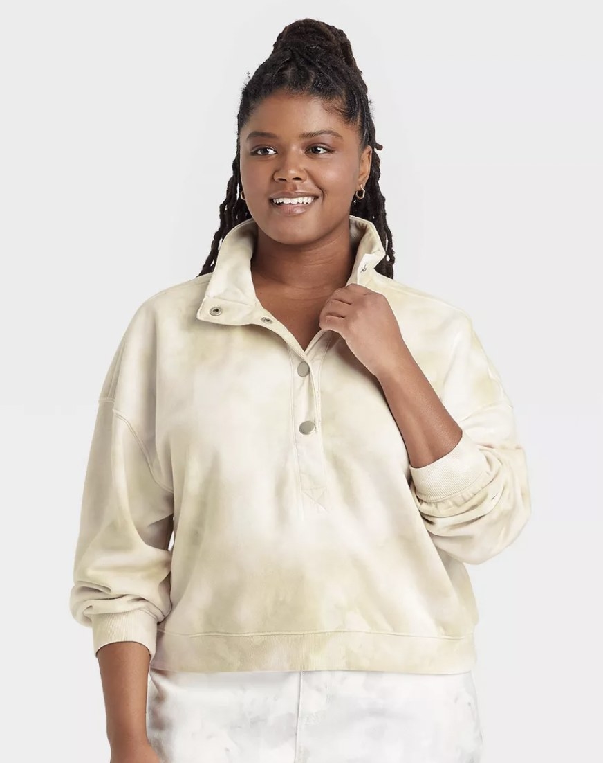 model wearing the sweater in a beige and white tie dye