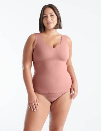 model posing in pink bra top and underwear