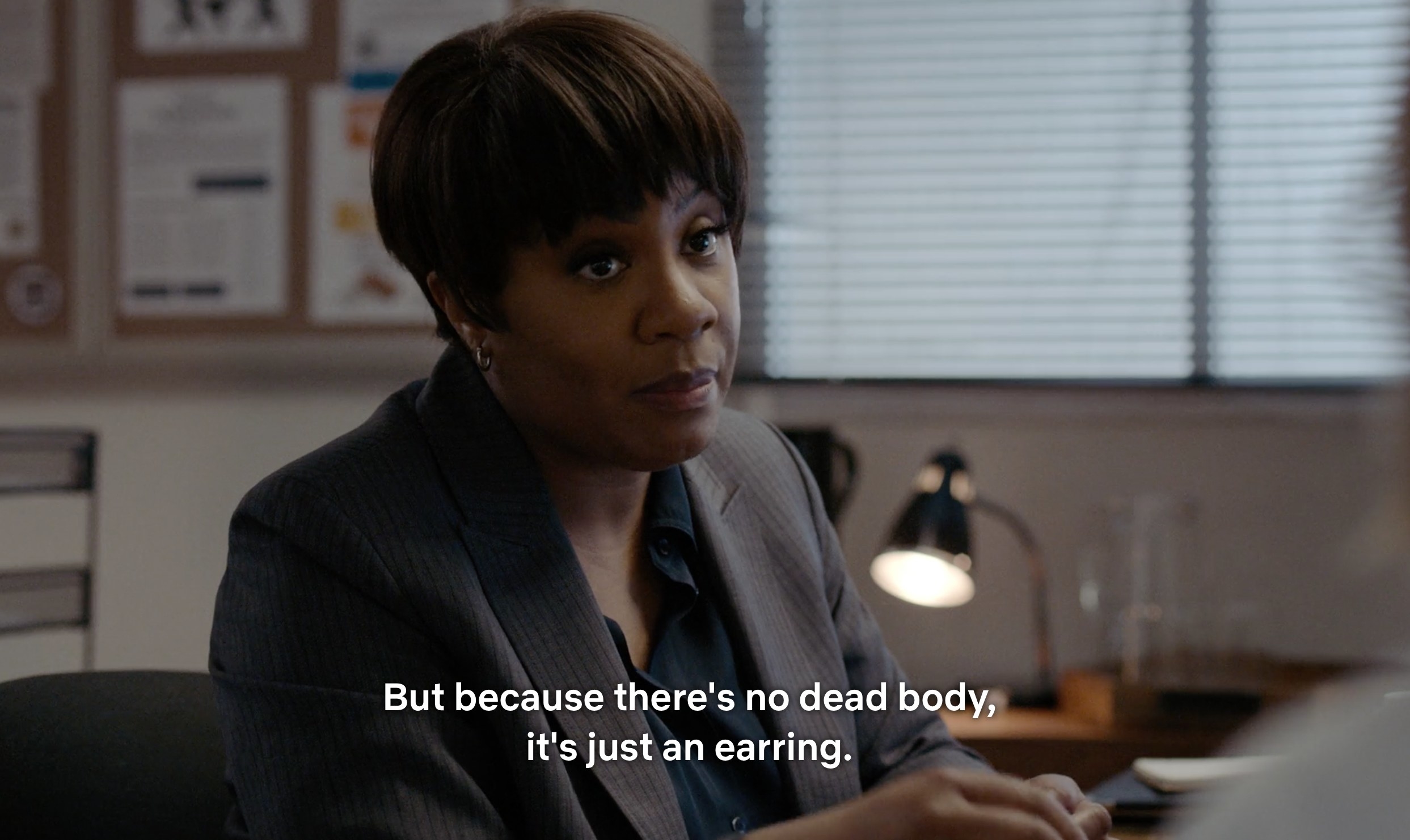 A female detective with short hair says &quot;But because there&#x27;s no dead body, it&#x27;s just an earring&quot;
