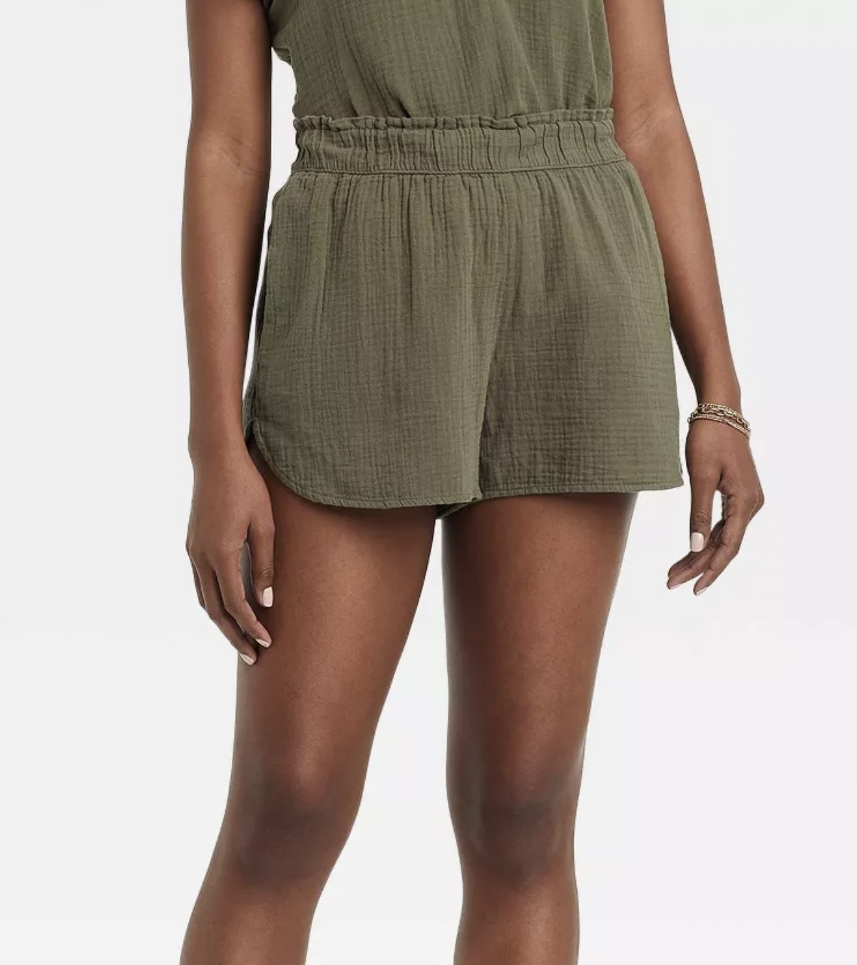 front view of the model wearing the shorts in green