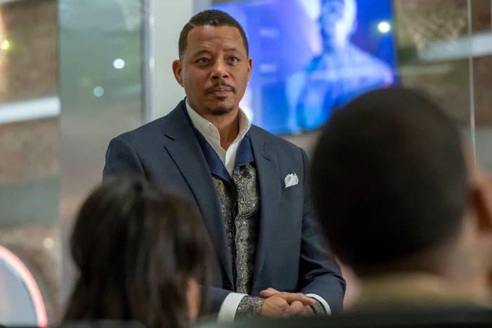 Terrence Howard standing in front of seated people