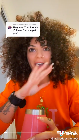 TikTok screenshot of Jaclyn with the words, &quot;They say &#x27;can I touch it,&#x27; I hear &#x27;can I pet you?&#x27;&quot;