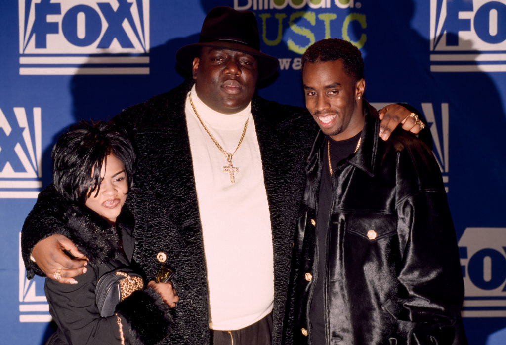 Rapper Notorious BIG joined by Sean Puffy Combs and Lil&#x27; Kim at the Billboard Music Awards on December 6, 1995