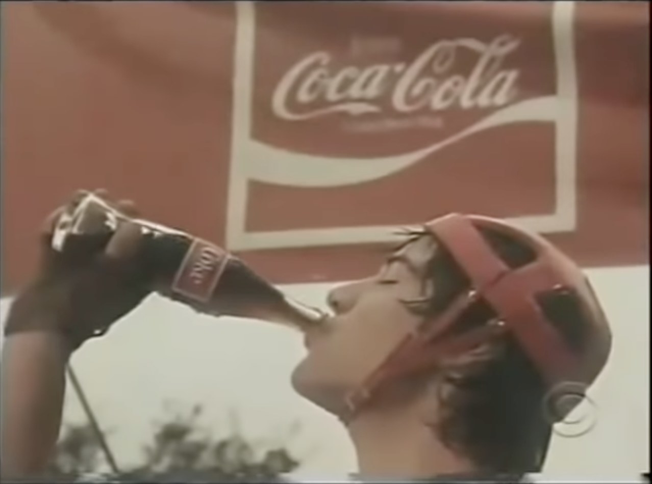 Keanu Reeves drinking a Coca-Cola in a Coca-Cola commercial
