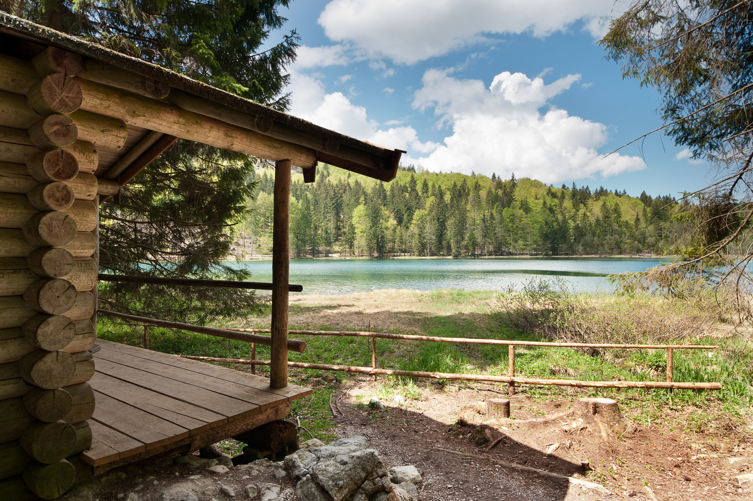 Cabin in front of a Bavarian crystal-clear lake