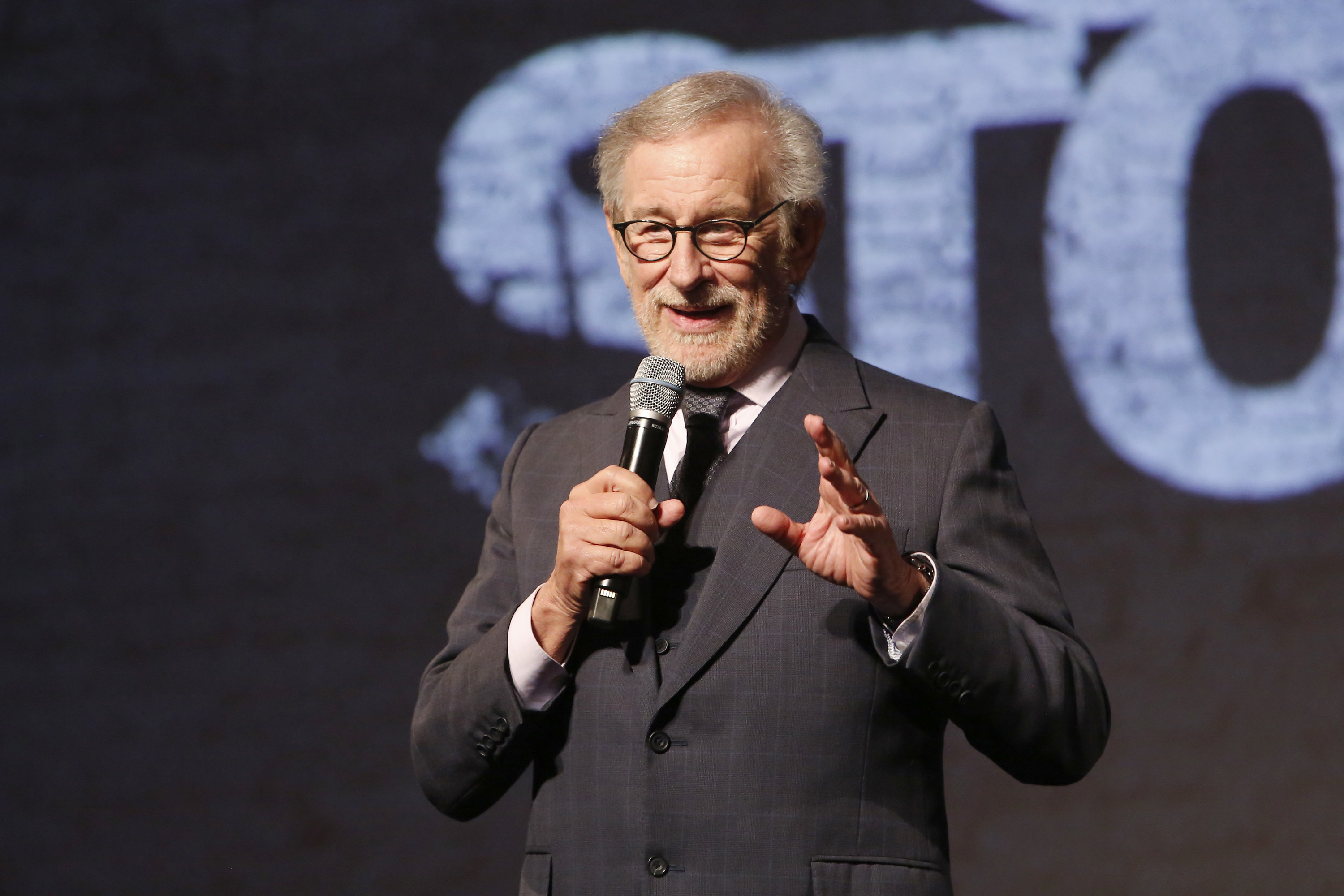 Steven Spielberg speaking onstage at the Los Angeles premiere of West Side Story