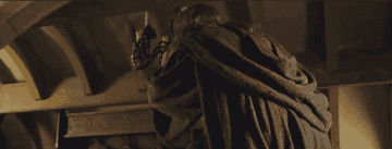 Ian McKellan as Gandalf turning around and hitting his head on the ceiling of Bilbo&#x27;s house in Lord of the Rings the Fellowship of the Ring