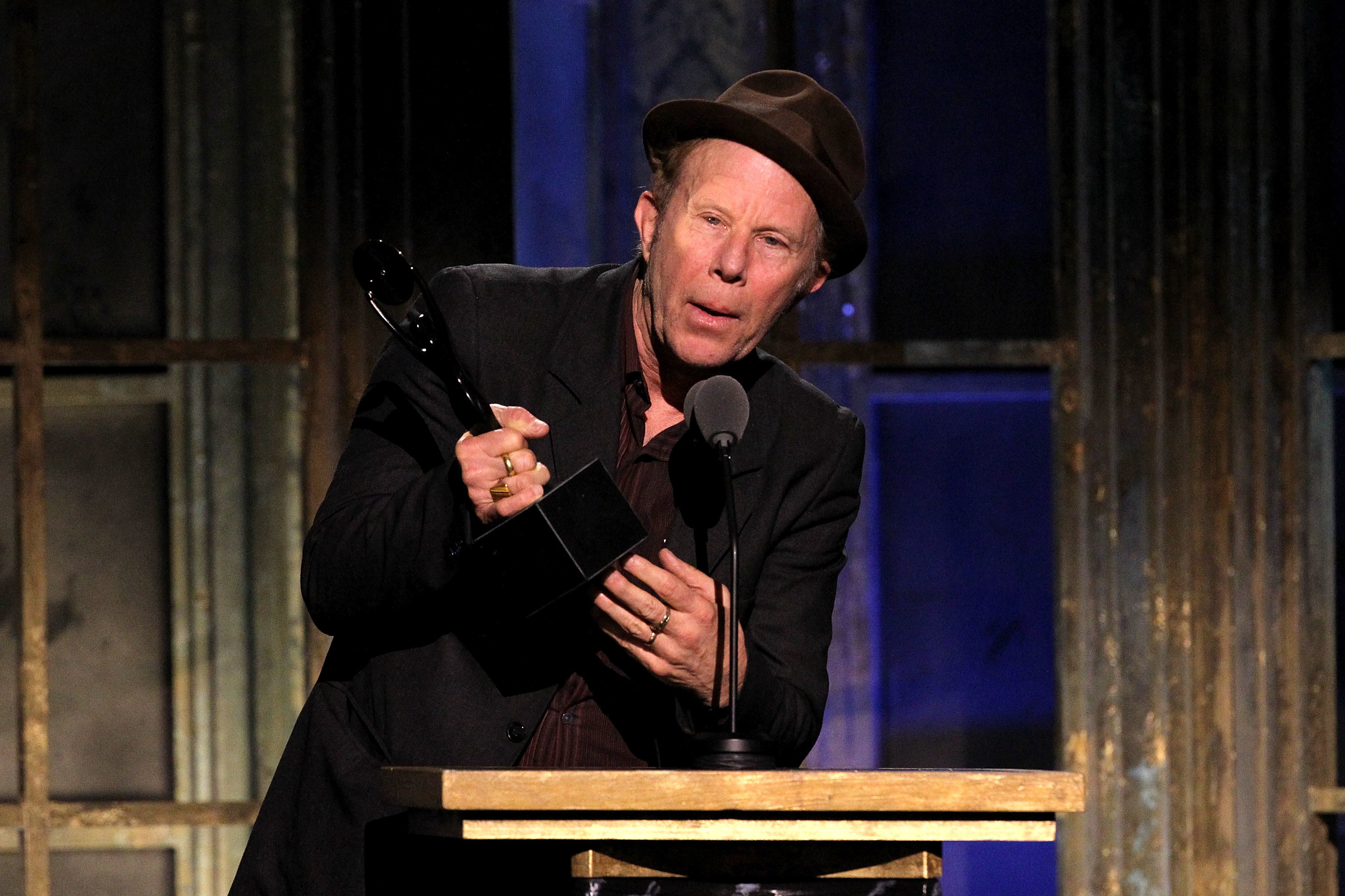 Tom Waits speaking onstage at the 26th annual Rock and Roll Hall of Fame Induction Ceremony