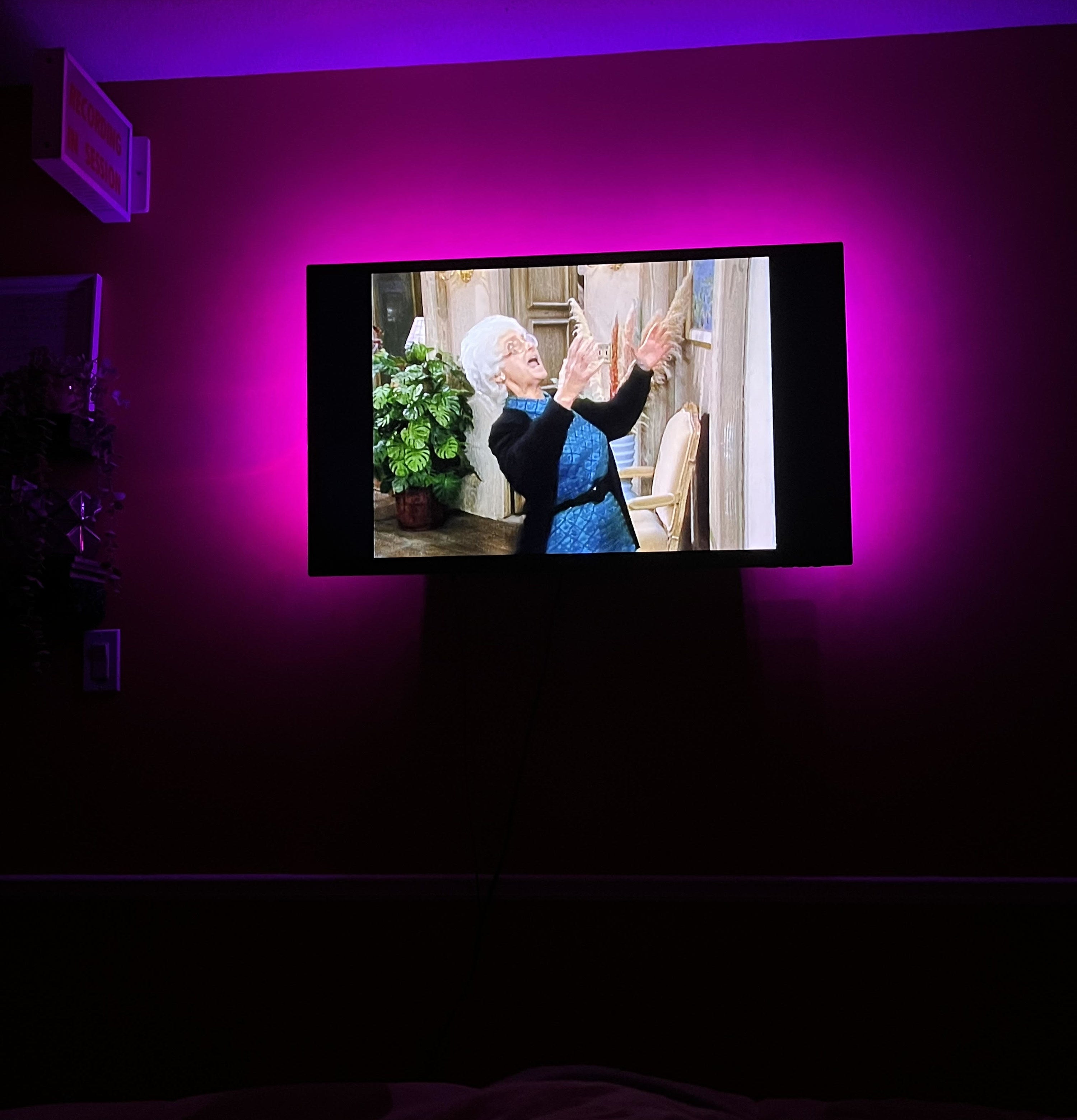 Bianca&#x27;s television at night playing an episode of The Golden Girls with the lights on behind her tv creating a glow around the screen