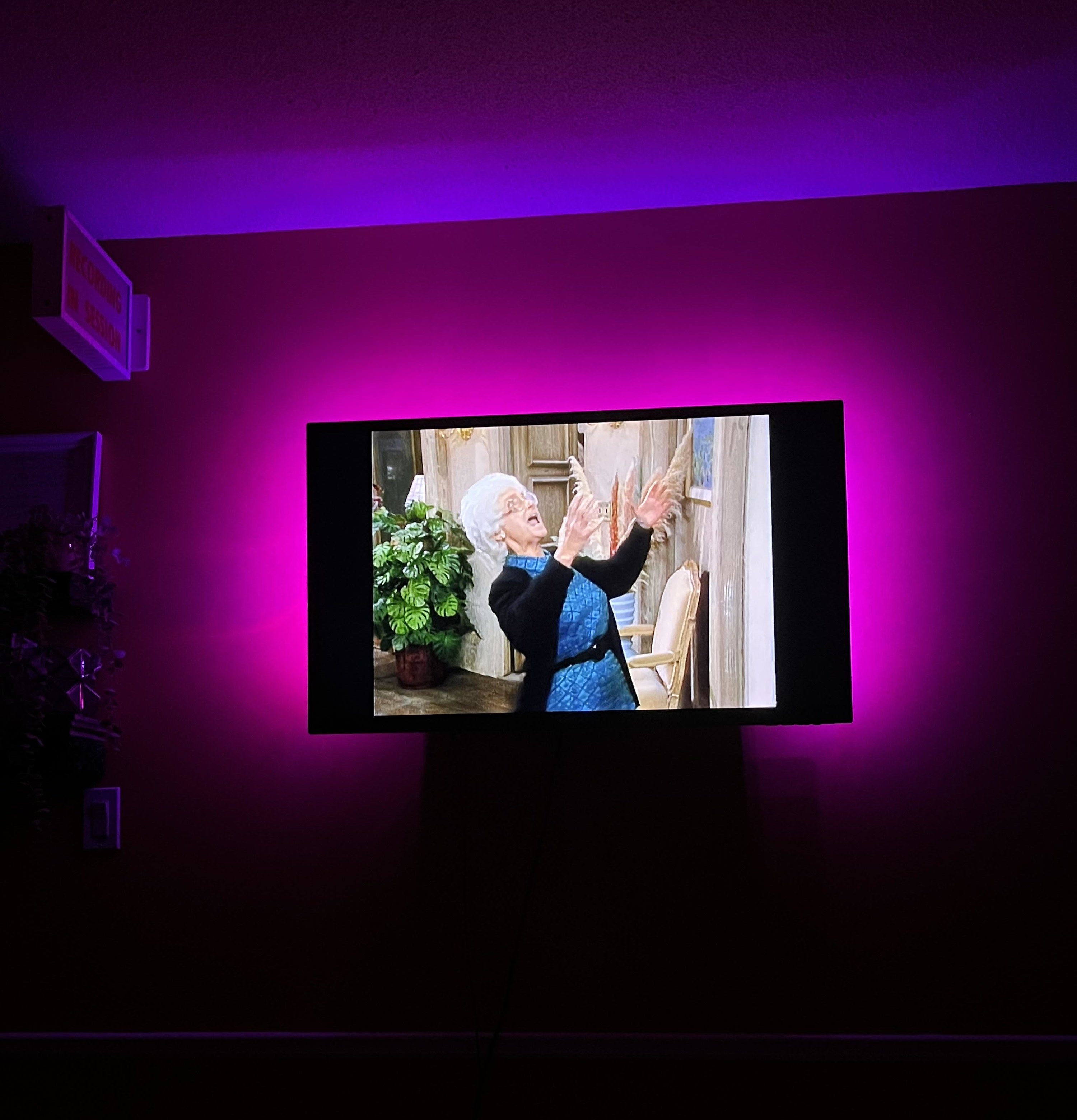 Bianca&#x27;s television at night playing an episode of The Golden Girls with the lights on behind her tv creating a glow around the screen